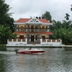 Mango Kerala Homes בית אירוח